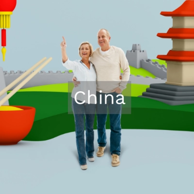 Reisendes Ehepaar vor chinesischen Bauwerken - Gut vorbereitet dank Reiseimpfcheck